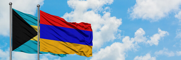 Bahamas and Armenia flag waving in the wind against white cloudy blue sky together. Diplomacy concept, international relations.