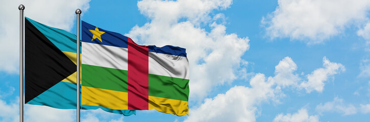 Bahamas and Central African Republic flag waving in the wind against white cloudy blue sky together. Diplomacy concept, international relations.