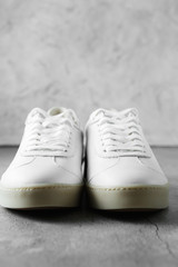 White plimsolls made of tumbled leather, matching laces, fabric lining and lightweight platform soles