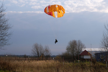 A paratrooper is landing.