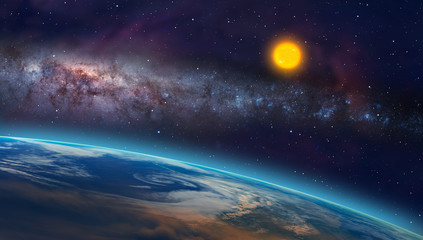 View of the planet Earth from space during a sunrise against milkyway galaxy and sun"Elements of this image furnished by NASA