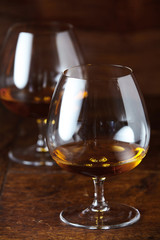 Two filled cognac glasses in close-up