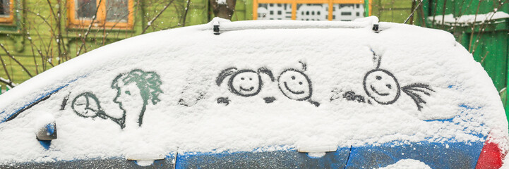 Dirty car in the snow on a village street