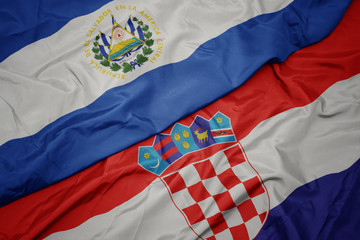 waving colorful flag of croatia and national flag of el salvador.