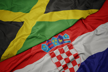 waving colorful flag of croatia and national flag of jamaica.