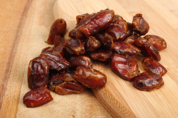 dried dates on wooden table