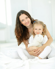 portrait of mother and beloved little daughter.