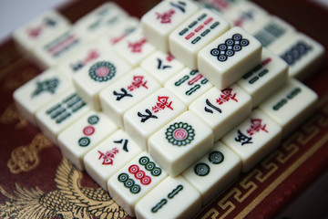 Pile of Mahjong ancient asian game on the wooden box