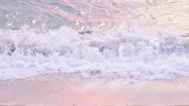 Waves On A Beach with sunset light.