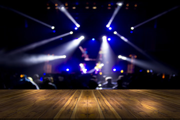 top desk with light bokeh in concert blur background,wooden table