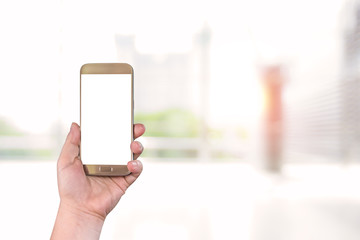 Hands holding smart phone with engineering construction concept blurred background