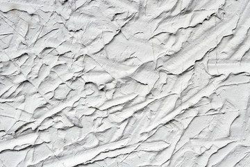 Decorative gray plaster effect on wall. Plaster texture. Closeup