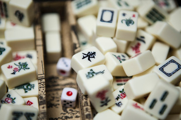 Pile of Mahjong ancient asian game in the wooden box