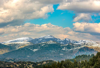  view of snow coated Helmos mountain which located in Peloponnese. Grecce.The photo taken from the opposite mountain named Mainalo