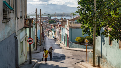san francisco street with people and a street sign in santiago de cuba