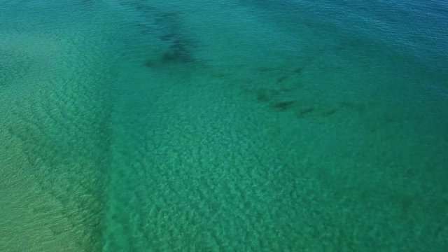 Aerial Drone Panning Above Turquoise Blue Ocean Water On A Sunny Day In Australia