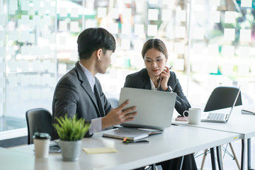 businessman and businesswoman discussing project at meeting. Business analysis and consaulting concept.
