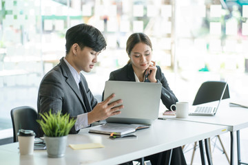 businessman and businesswoman discussing project at meeting. Business analysis and consaulting concept.