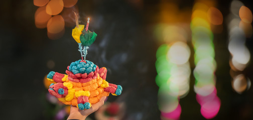 Woman holding Krathong, Loy Krathong is new year festival celebrated annually in Thailand.