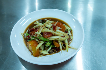 Spicy Green Papaya Salad In dish.,Copy space text.