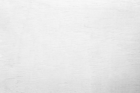 White plywood textured wooden background or wood surface of the old at grunge dark grain wall texture of panel top view. Vintage teak surface board at desk with light pattern natural.