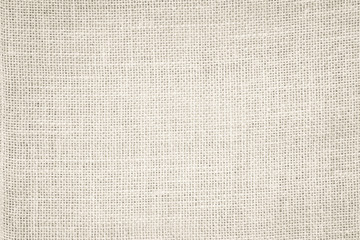 Fototapeta na wymiar Cream Hemp rope texture background. Haircloth or blanket wale linen wallpaper. Rustic sackcloth canvas fabric texture in natural. Natural vintage linen burlap weaving, Old beige carpet background.