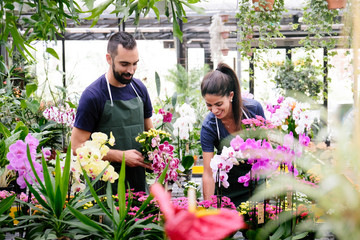 Teamwork With Happy Co-workers At Work In Florist Shop