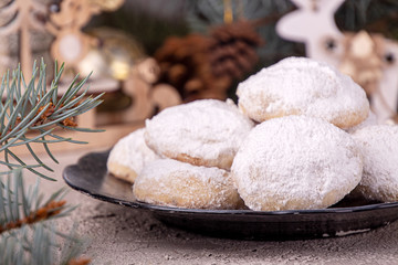 Traditional Christmas cookies biscuits snowballs covered icing sugar povder with almond nut, nutella chocolate an raspberry jam. Christmas New Year ornament decorations.