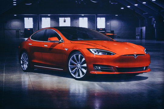 Berlin, August 29, 2018: Photo of the image of an electric vehicle Tesla at the Tesla motor show in Berlin. A modern electric car.