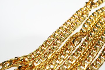 group of gold necklace isolated on white background