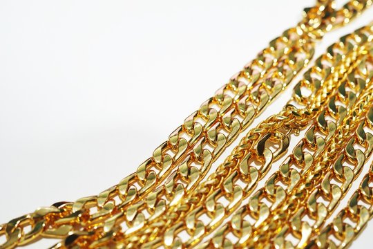 group of gold necklace isolated on white background