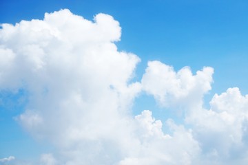blue sky background with clouds, beautiful cloudscape, view over white fluffy clouds, freedom concept