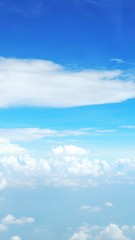blue sky background with clouds, beautiful cloudscape, view over white fluffy clouds, freedom concept