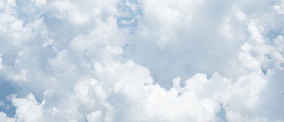 blue sky background with clouds, beautiful cloudscape, view over white fluffy clouds, freedom concept
