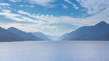 The view at sunset from the front of a ferry as it makes its way through the Inside Passage off the rugged west coast of Canada