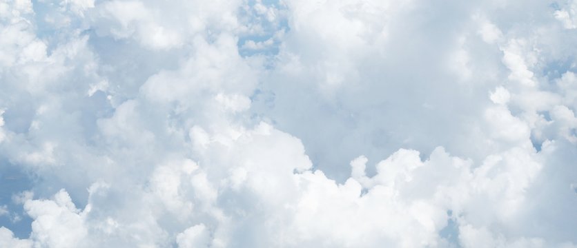 blue sky background with clouds, beautiful cloudscape, view over white fluffy clouds, freedom concept