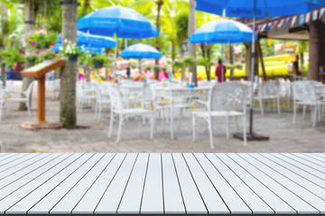 Obraz na płótnie Canvas Top desk with blur restaurant background,wooden table,street food stall