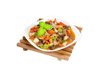 Sweet and sour sauce fried with pork on wood background