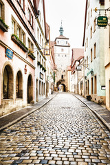 ROTHENBURG OB DER TAUBER, GERMANY - MARCH 05: Typical street on March 05, 2016 in Rothenburg ob der Tauber, Germany. It is well known for its well-preserved medieval old town.