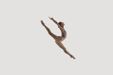 Modern ballet dancer. Contemporary art ballet. Young flexible athletic woman.. Studio shot isolated on white background. Negative space.