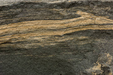 background of cross section dirty sand layers in nature beach