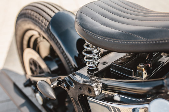 Leather motorcycle seat with springs - close-up