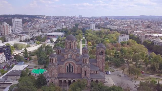 Establishing 4k aerial shot of Crkva svetog Marka and Tasmajdan park in Beograd Srbija