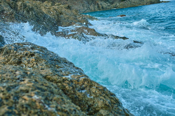 Rocky coast by the sea. Sky in the clouds