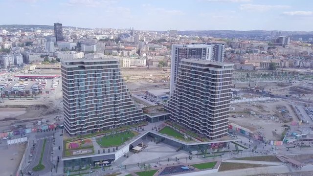 Descending aerial 4k shot of Belgrade Waterfront on Sava river and Promenada