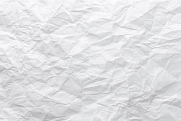 Top view closeup sheet of white crumpled uneven paper. Abstract modern trendy texture background