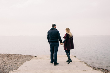 couple hugging on a pier
