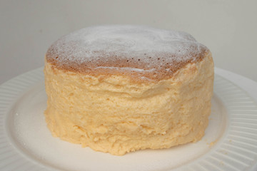 Japanese jiggly cheesecake topped with sugar powder.