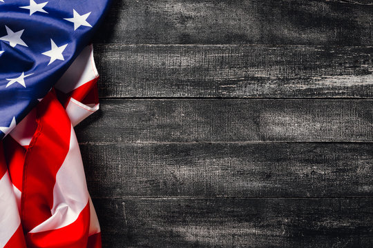 American flag on dark background.Flag Veterans Day Concept with place for your text
