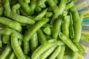 green peas in a plate, background